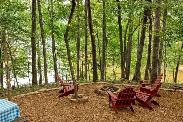a backyard of a house with outdoor seating