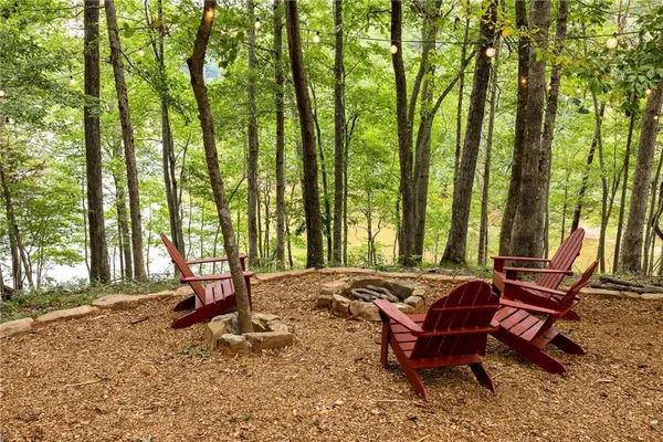 a view of a backyard with sitting area