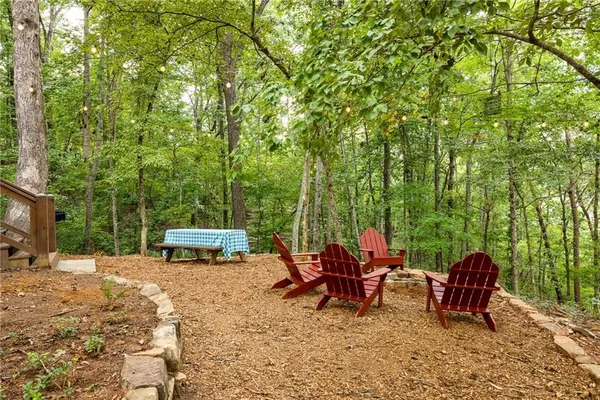 a view of a backyard with sitting area