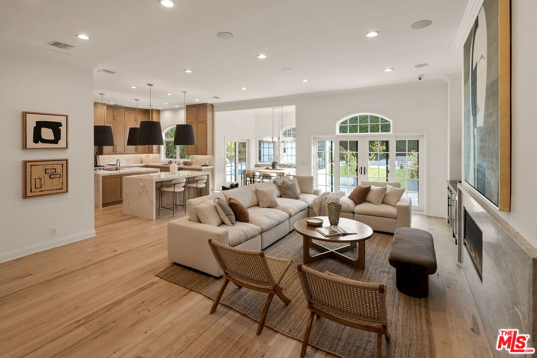 280 Homewood Road Los Angeles, CA 90049 - Photo 11 of 53 a living room with furniture and a flat screen tv