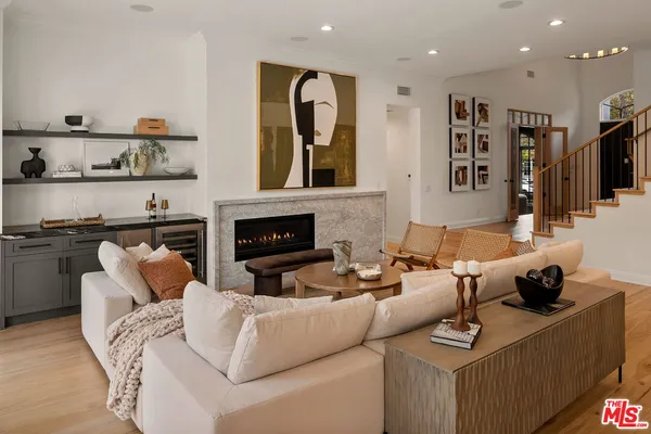 a bedroom with a bed and a mirror