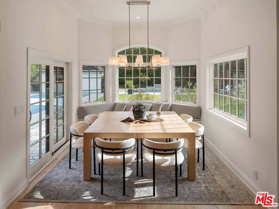 280 Homewood Road Los Angeles, CA 90049 - Photo 17 of 53 a view of a dining room with furniture window and outside view