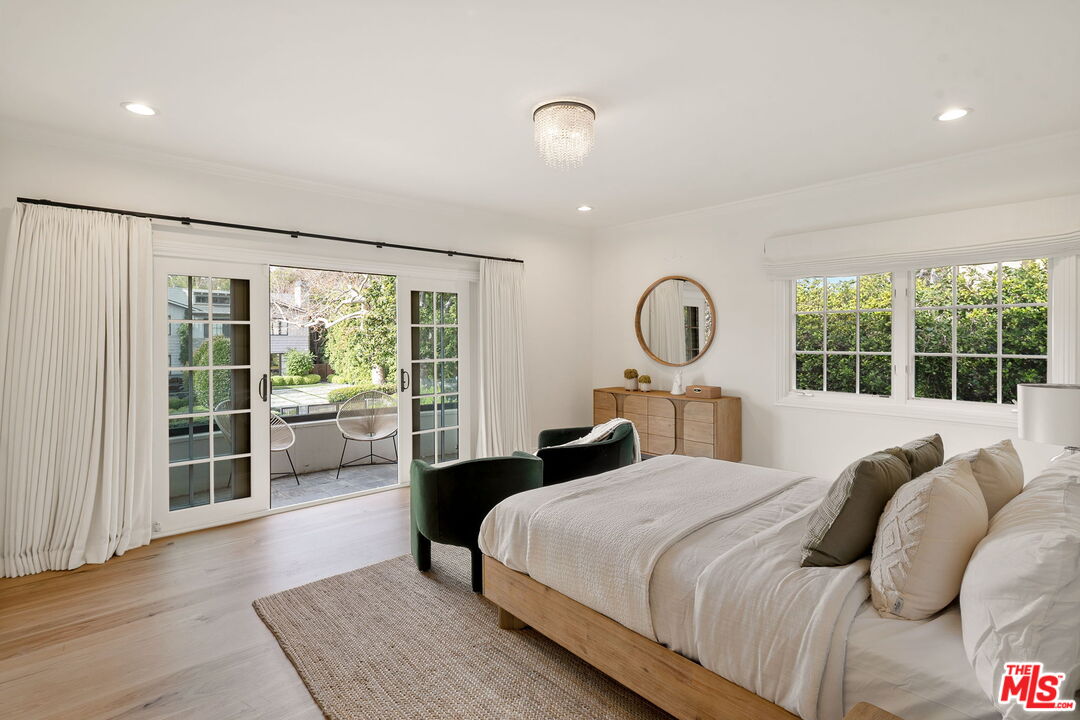 280 Homewood Road Los Angeles, CA 90049 - Photo 33 of 53 a bedroom with a large bed and a large window