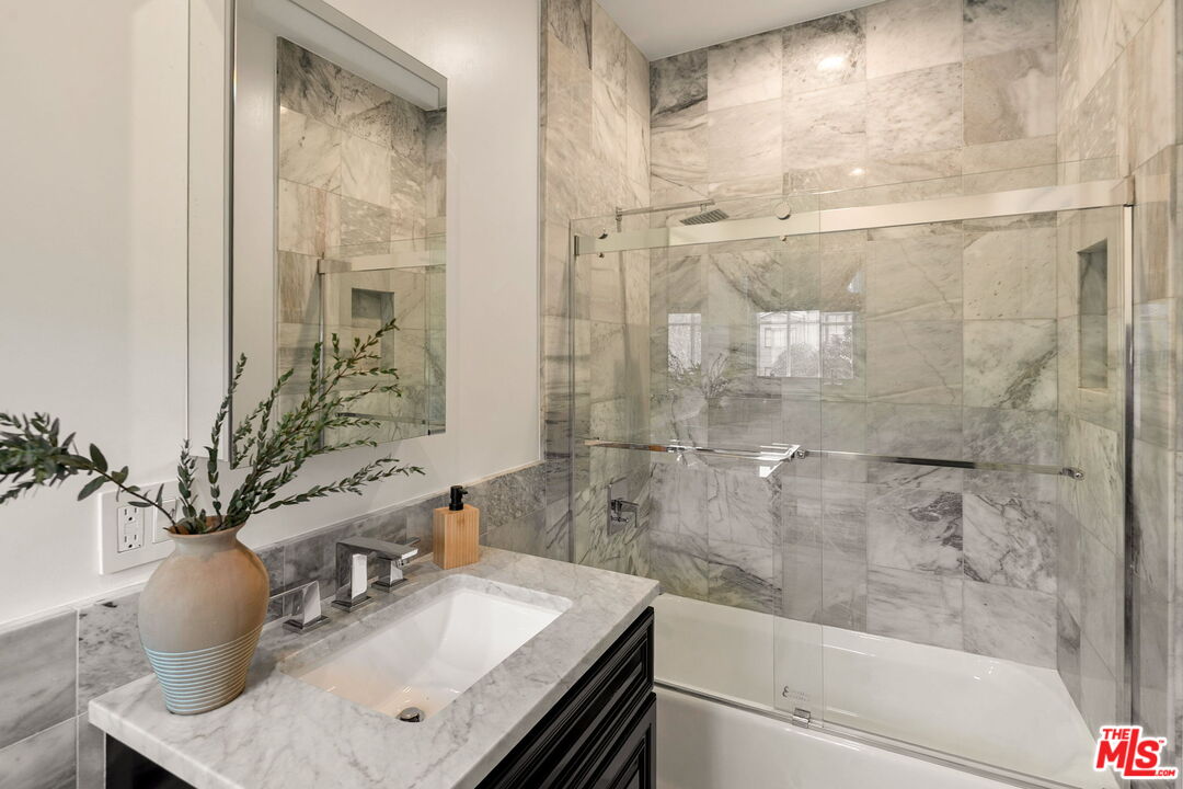 280 Homewood Road Los Angeles, CA 90049 - Photo 38 of 53 a bathroom with a sink toilet and shower