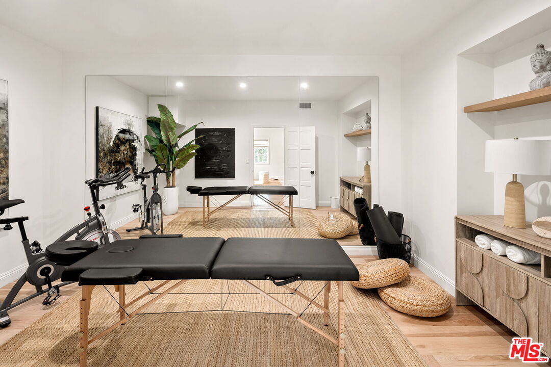 280 Homewood Road Los Angeles, CA 90049 - Photo 51 of 53 a living room with furniture and wooden floor