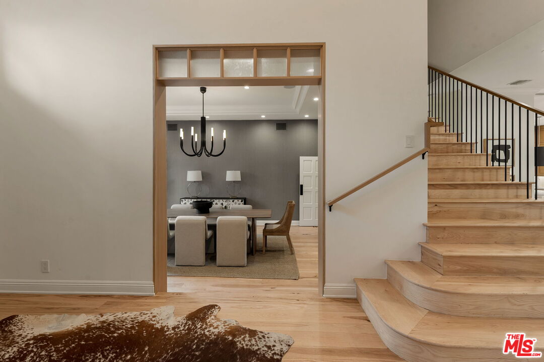 280 Homewood Road Los Angeles, CA 90049 - Photo 8 of 53 a view of entryway and hall with wooden floor