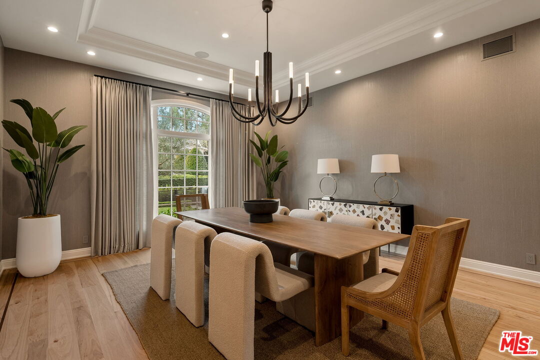 280 Homewood Road Los Angeles, CA 90049 - Photo 9 of 53 a view of a dining room with furniture window and wooden floor