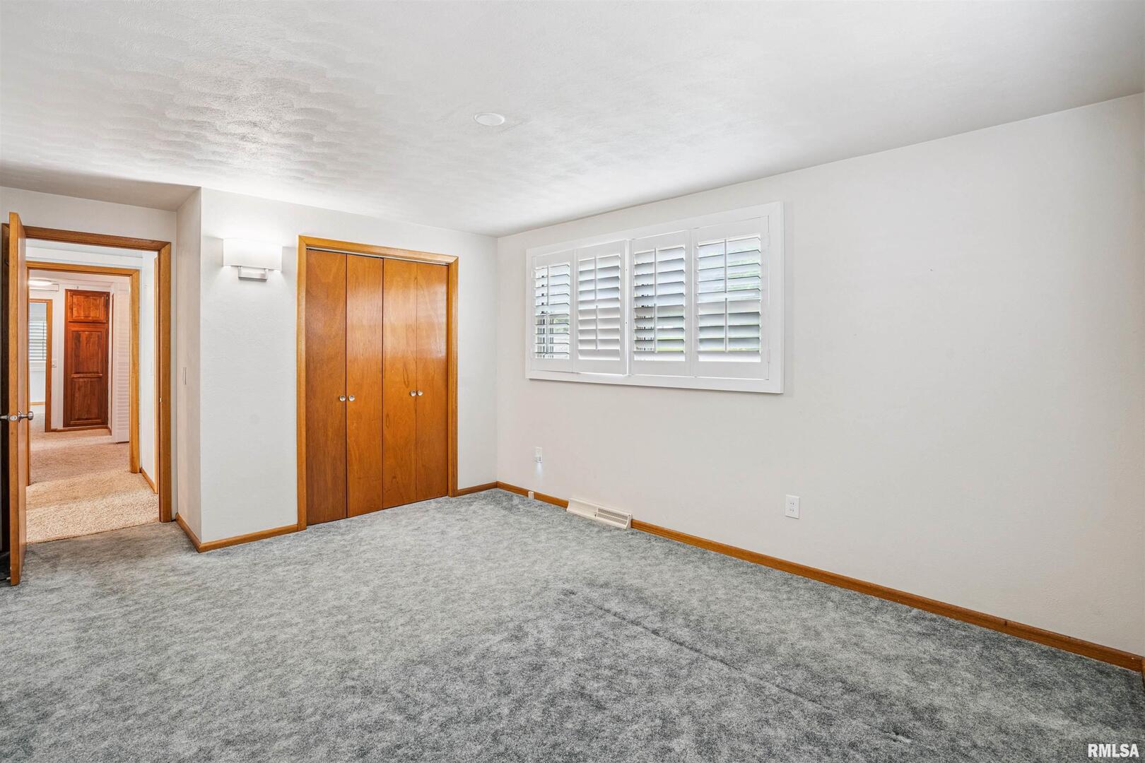 22799 Great River Road Le Claire, IA 52753 - Photo 21 of 48 an empty room with a window