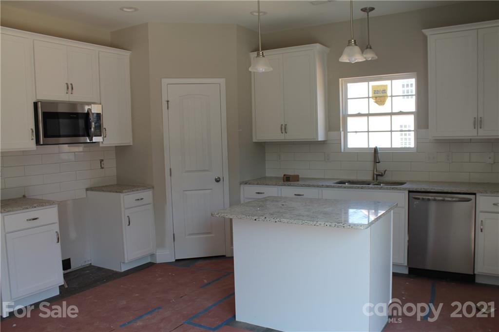 4813 Stack Road Monroe, NC 28112 - Photo 5 of 9 a kitchen with cabinets appliances a sink and a window