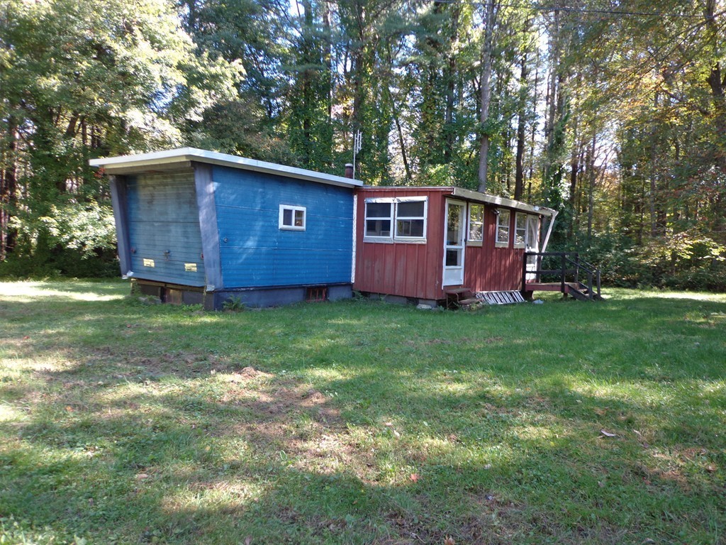 225 Osborne Road Ware, MA 01082 - Photo 2 of 8 a view of backyard with barn and large trees