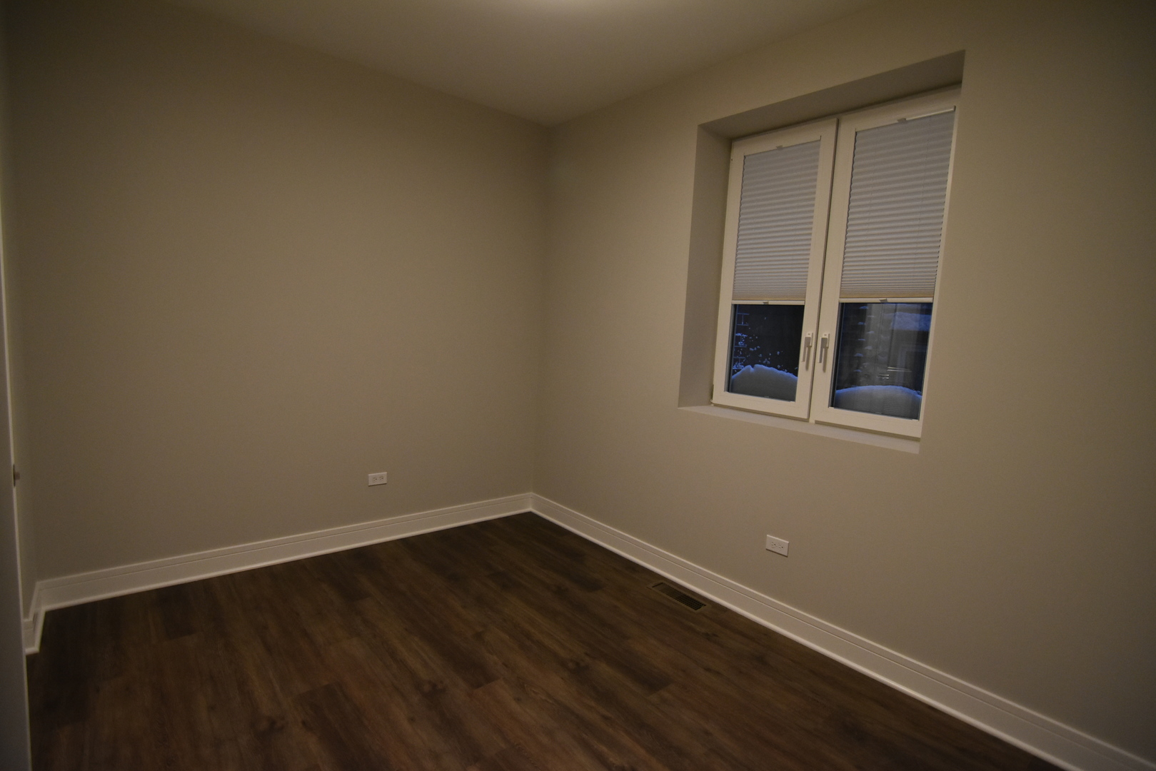 Undisclosed Address Chicago, IL 60613 - Photo 11 of 17 a view of an empty room with wooden floor and a window