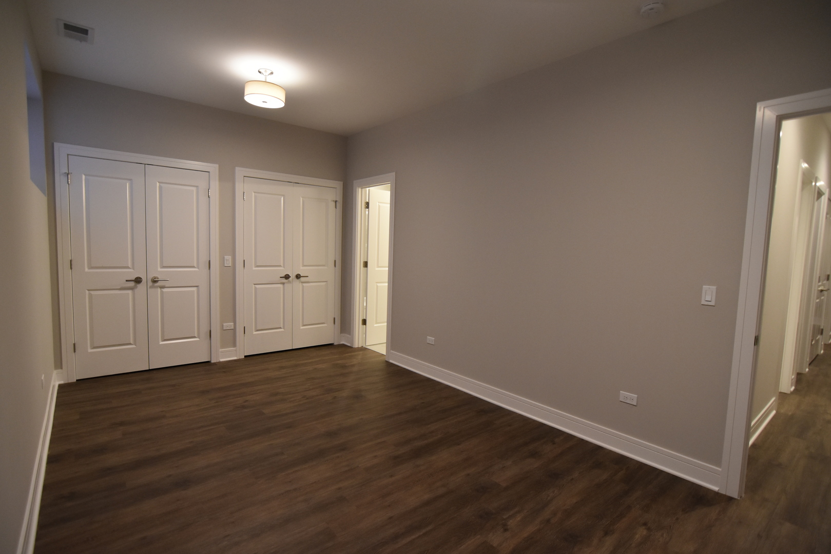 Undisclosed Address Chicago, IL 60613 - Photo 13 of 17 a view of an empty room with wooden floor and closet