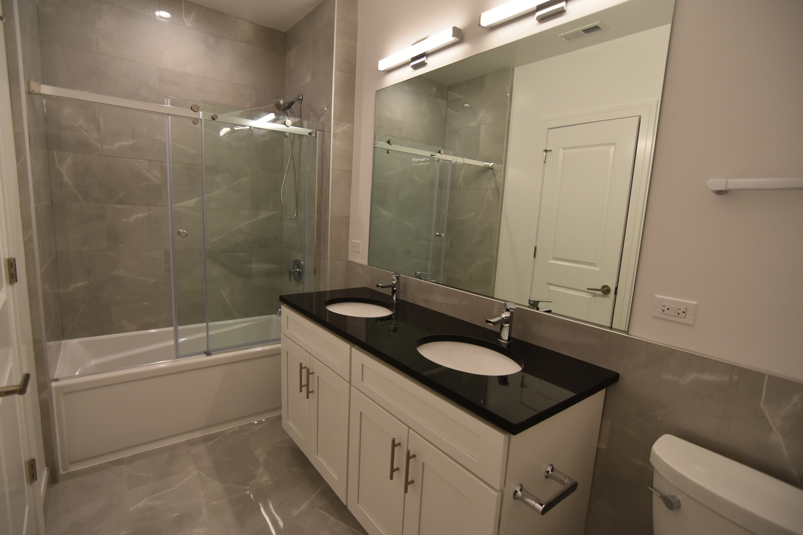 Undisclosed Address Chicago, IL 60613 - Photo 14 of 17 a bathroom with a sink and a mirror