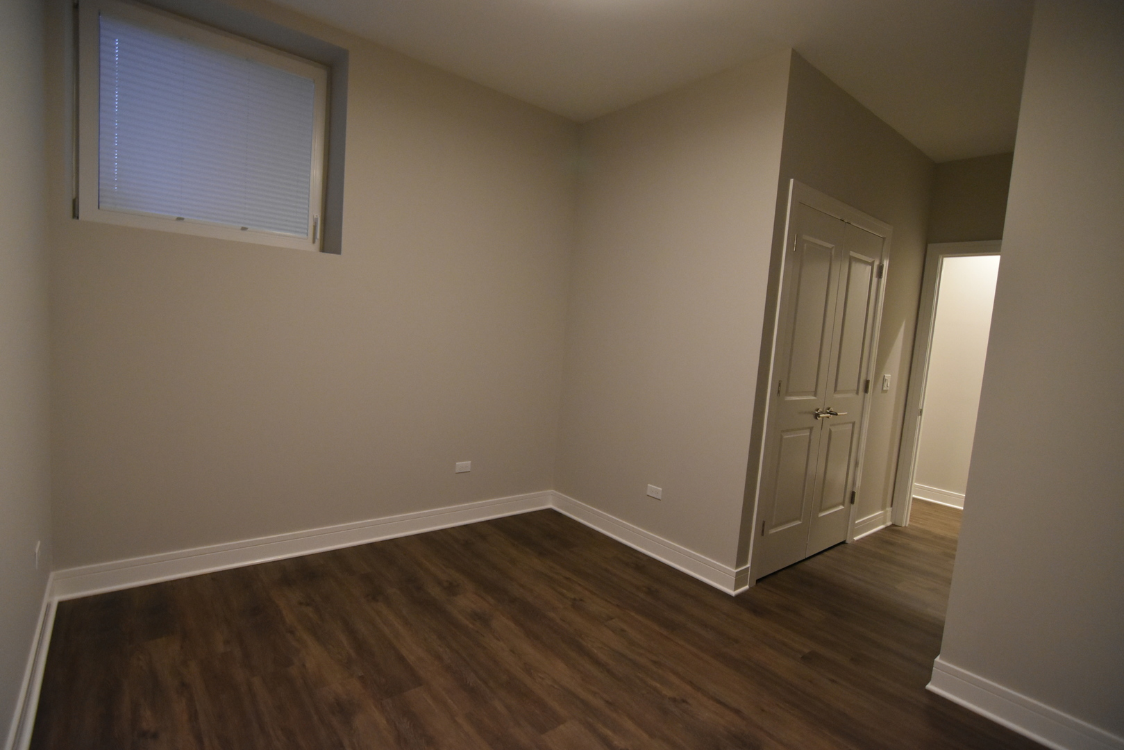 Undisclosed Address Chicago, IL 60613 - Photo 16 of 17 a view of a small space with wooden floor and a window