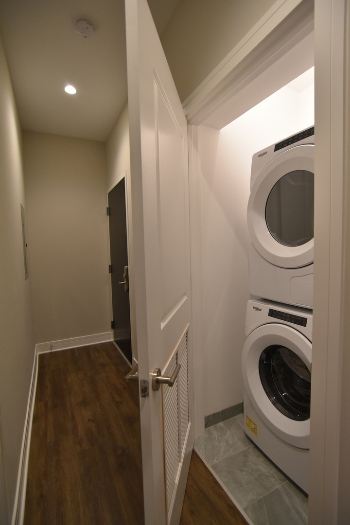 Undisclosed Address Chicago, IL 60613 - Photo 17 of 17 a view of a hallway with washer and dryer