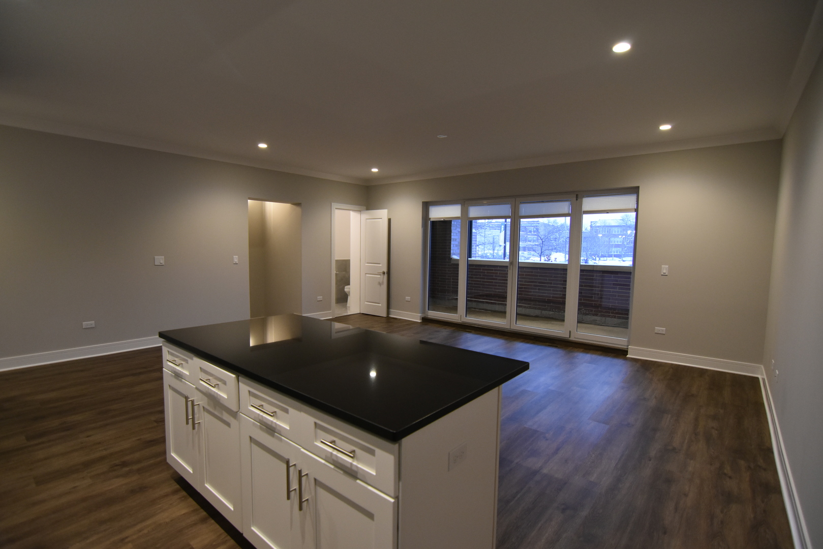 Undisclosed Address Chicago, IL 60613 - Photo 2 of 17 a kitchen with granite countertop a sink and wooden floor