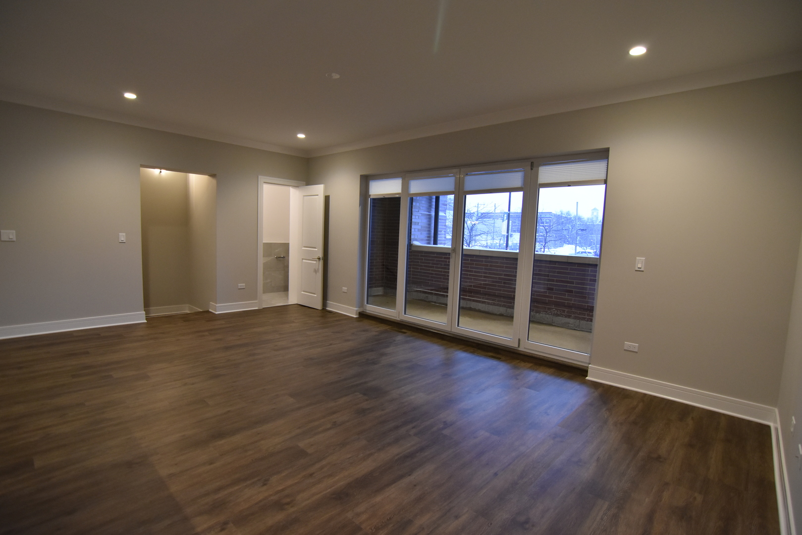 Undisclosed Address Chicago, IL 60613 - Photo 3 of 17 a view of empty room with wooden floor and fan