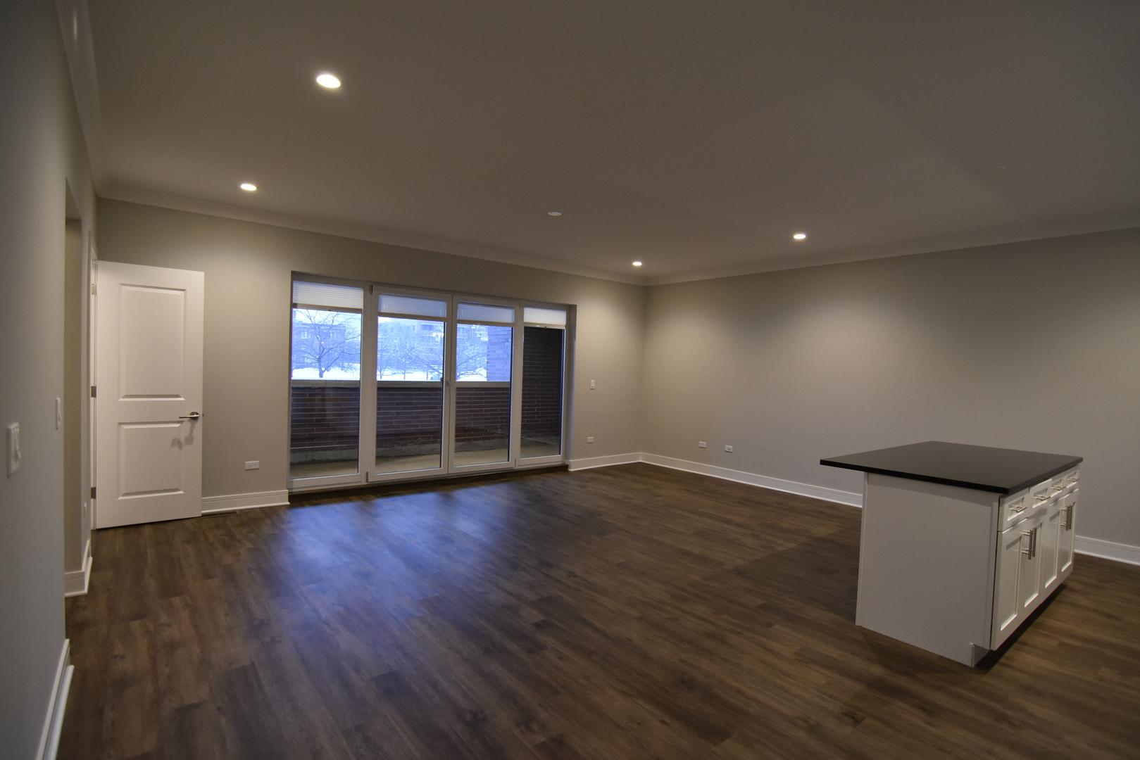 Undisclosed Address Chicago, IL 60613 - Photo 4 of 17 a view of empty room with wooden floor and fan