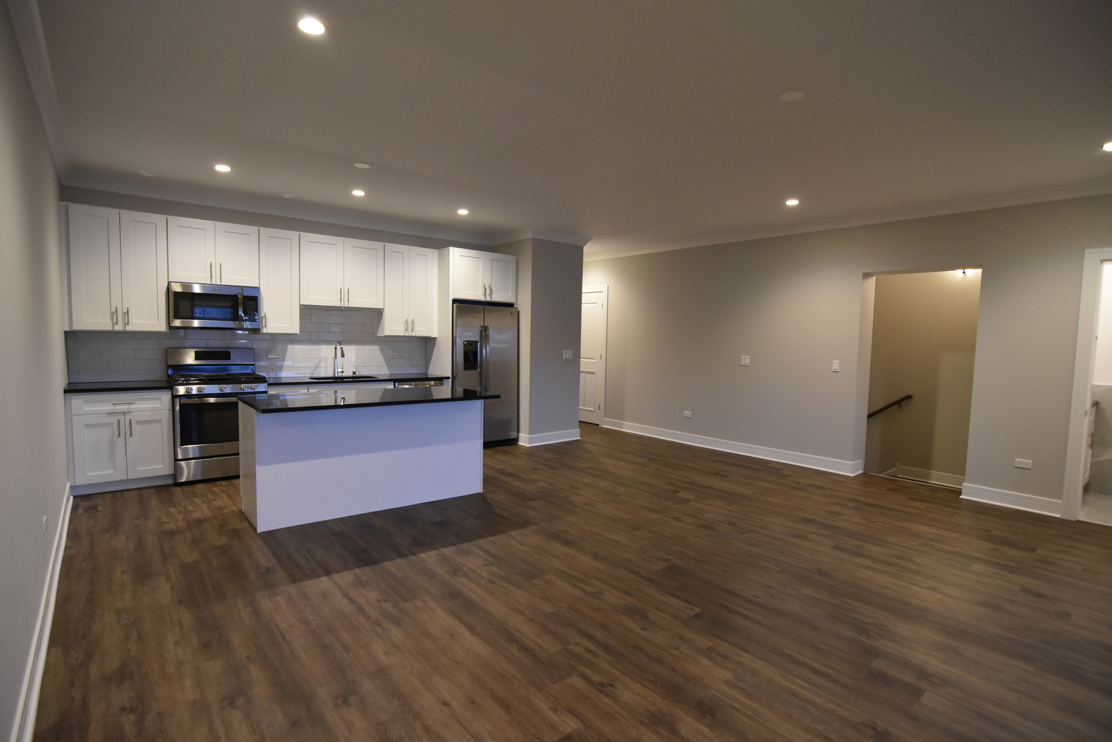 Undisclosed Address Chicago, IL 60613 - Photo 6 of 17 a kitchen with granite countertop stainless steel appliances and wooden cabinets