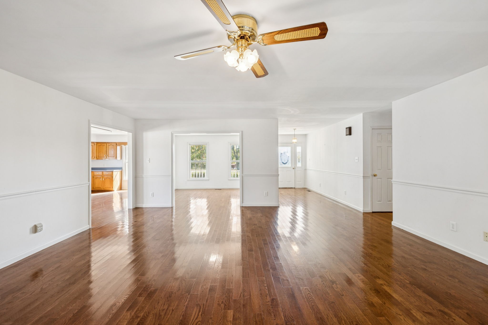 240 Hurst Road Hohenwald, TN 38462 - Photo 15 of 76 a view of an empty room with window and wooden floor