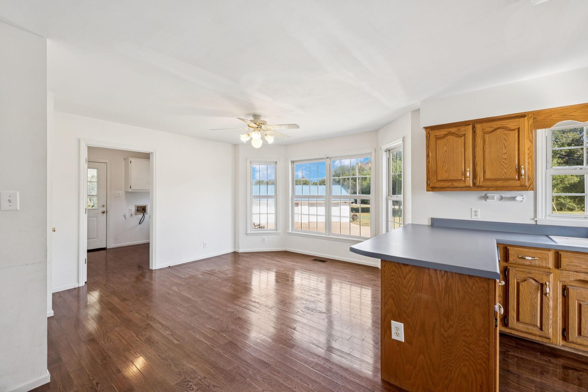 240 Hurst Road Hohenwald, TN 38462 - Photo 18 of 76 a view of kitchen with granite countertop cabinets and wooden floor
