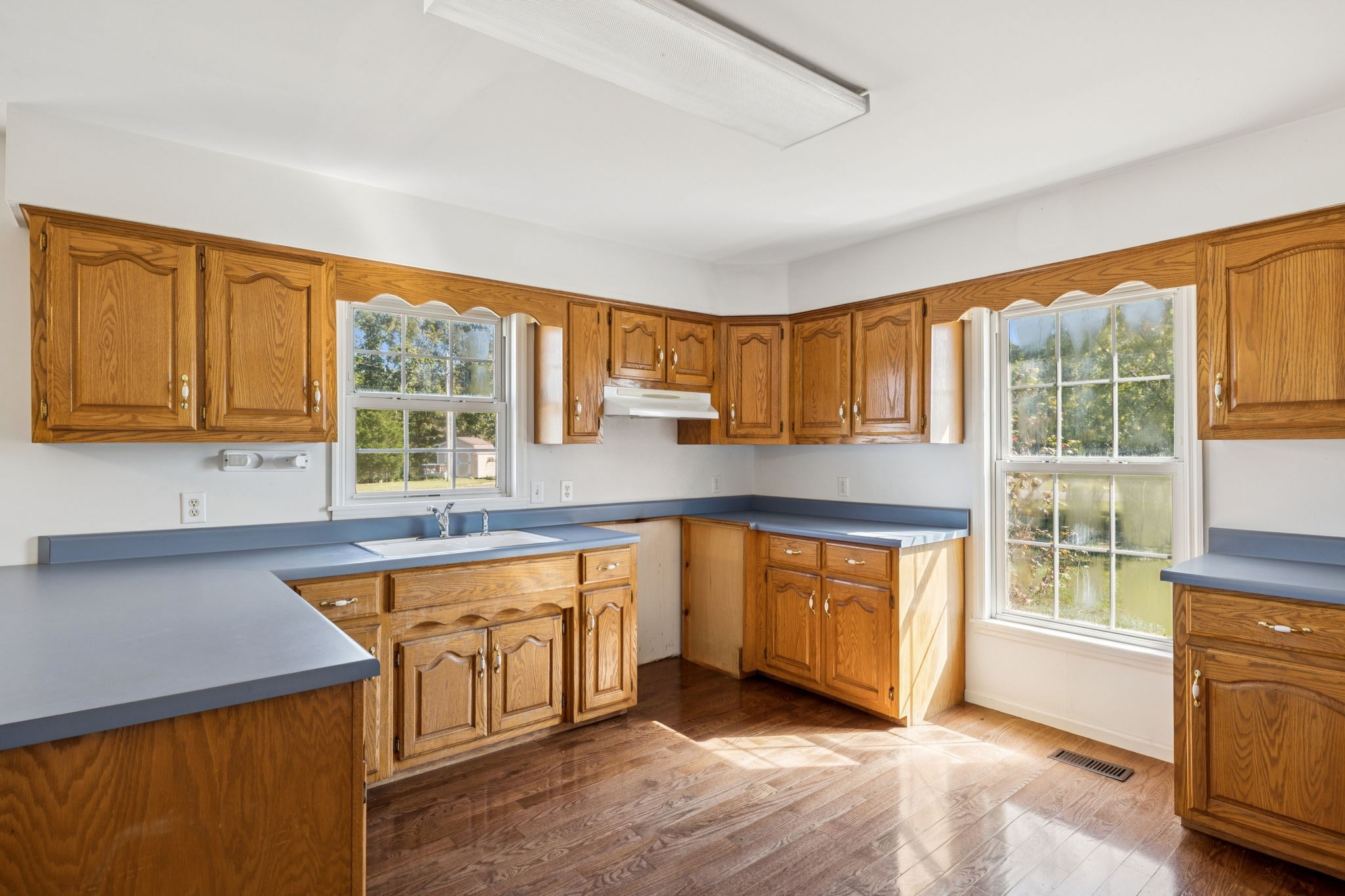 240 Hurst Road Hohenwald, TN 38462 - Photo 20 of 76 a kitchen with stainless steel appliances granite countertop a stove a sink and a microwave