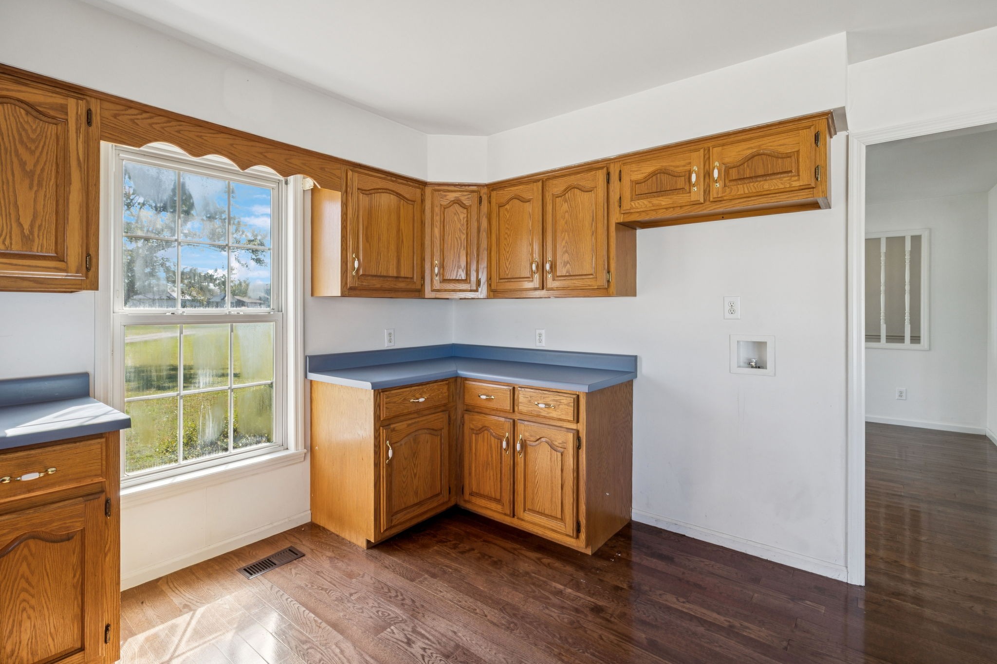 240 Hurst Road Hohenwald, TN 38462 - Photo 22 of 76 a living room with stainless steel appliances wooden floor and a window