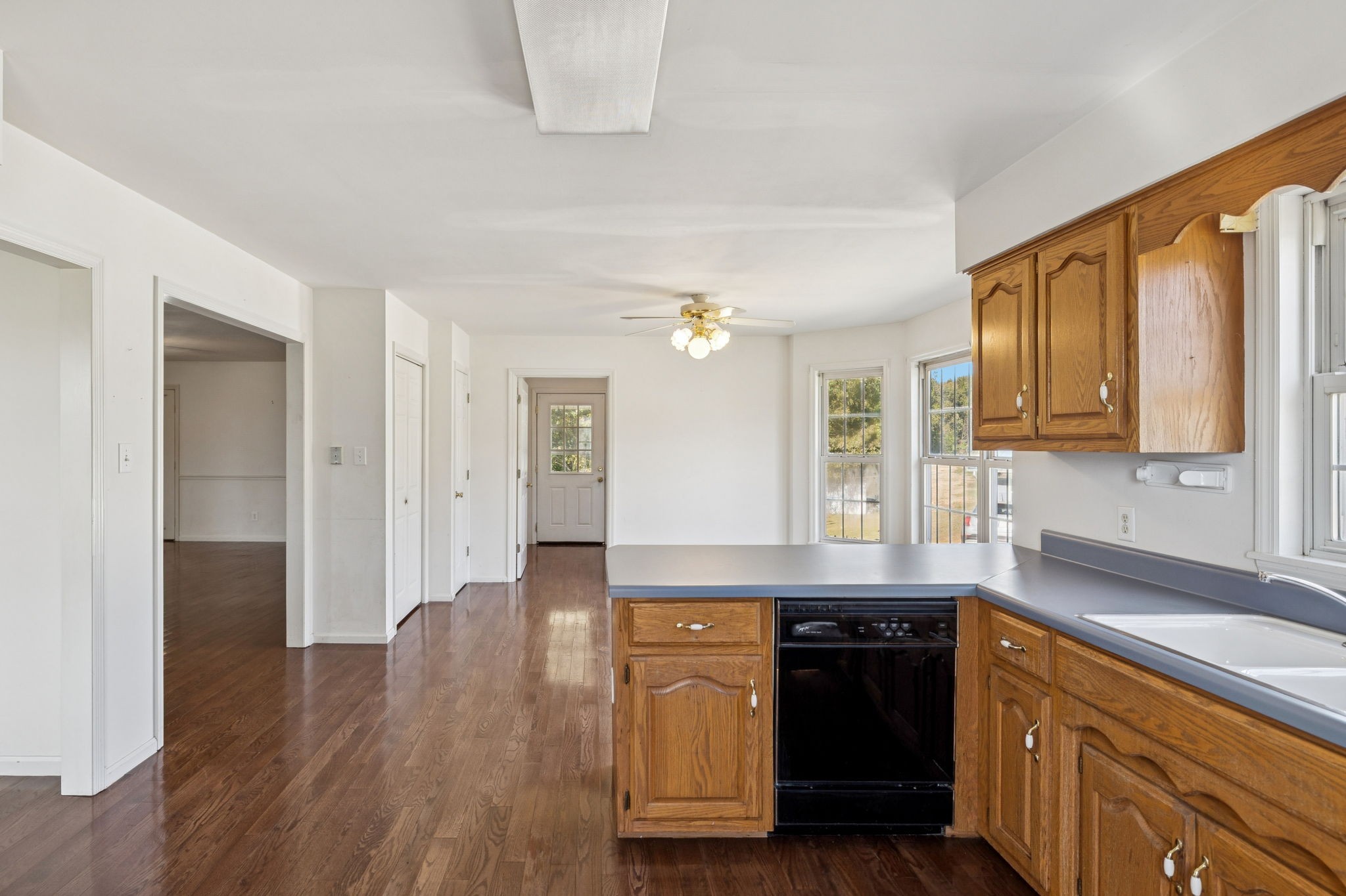 240 Hurst Road Hohenwald, TN 38462 - Photo 23 of 76 a kitchen with kitchen island granite countertop a sink cabinets and stainless steel appliances