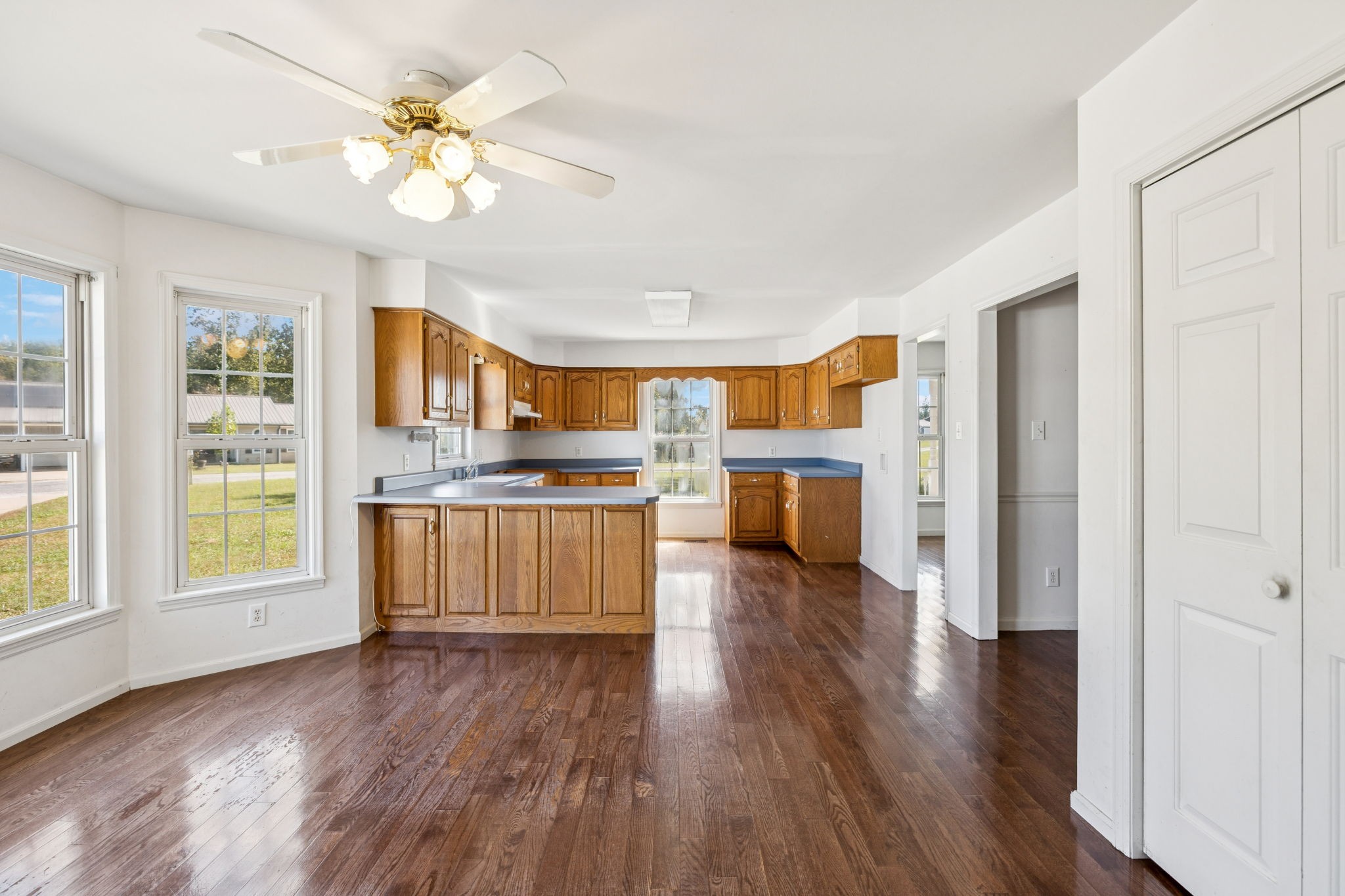 240 Hurst Road Hohenwald, TN 38462 - Photo 24 of 76 a view of kitchen with cabinets and wooden floor