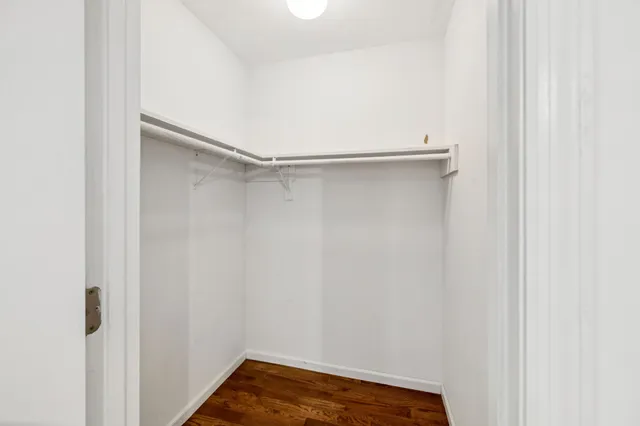 an aerial view of a house with a lake