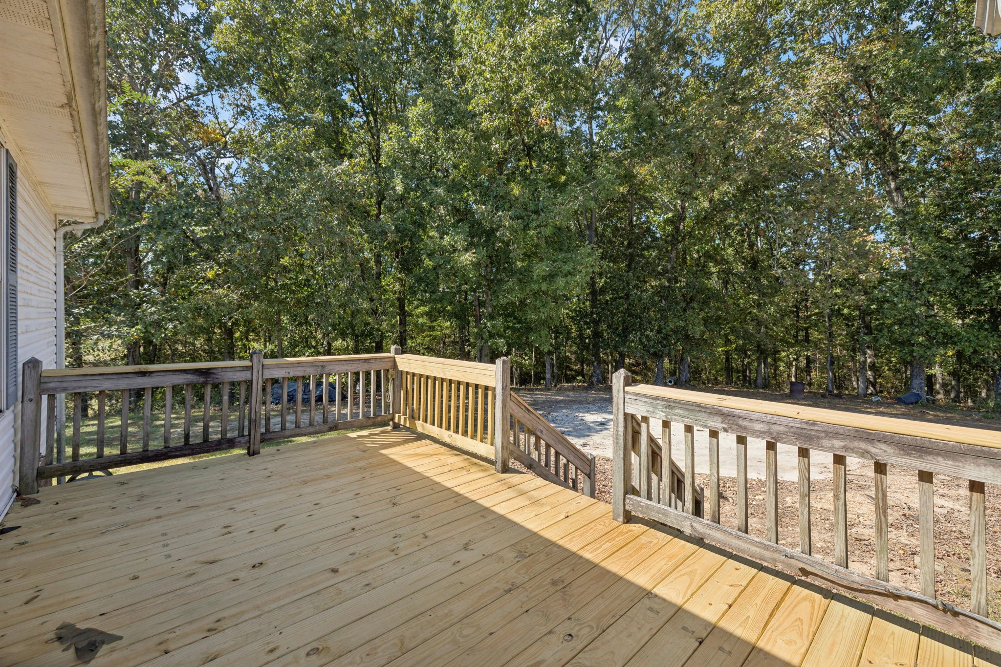 240 Hurst Road Hohenwald, TN 38462 - Photo 43 of 76 a balcony with wooden floor and fence