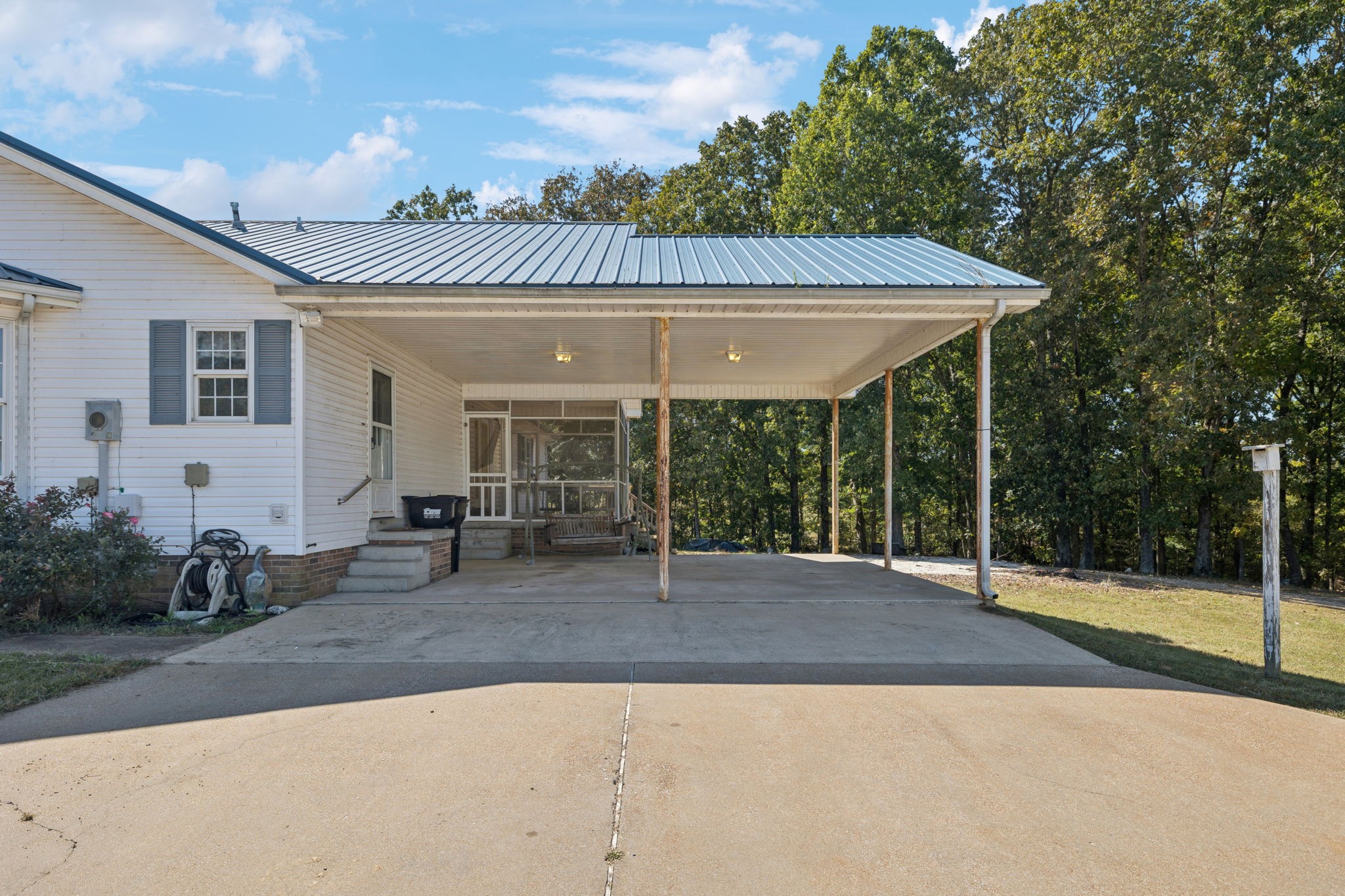 240 Hurst Road Hohenwald, TN 38462 - Photo 51 of 76 a backyard of a house with seating space