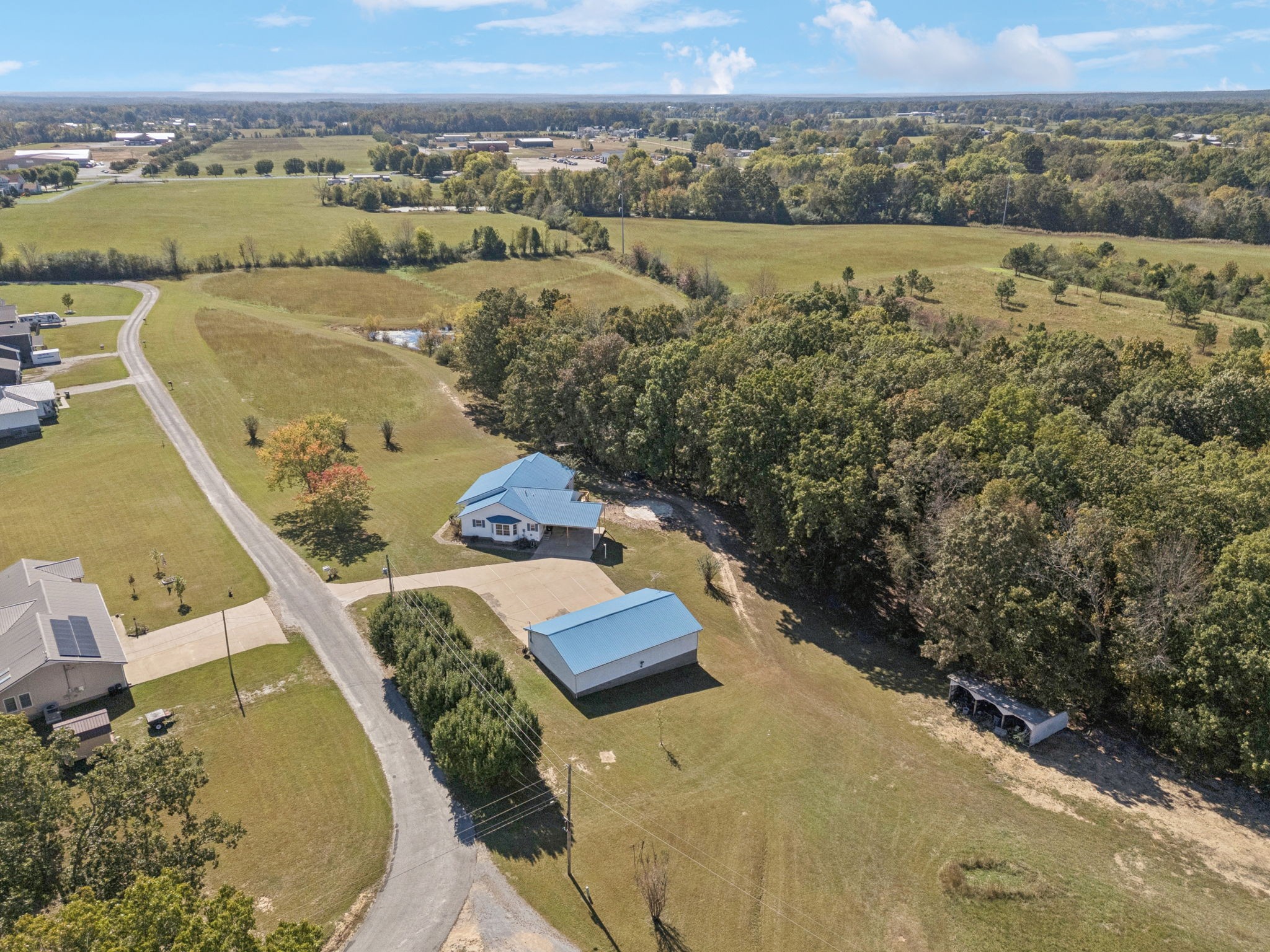 240 Hurst Road Hohenwald, TN 38462 - Photo 58 of 76 an aerial view of a house with a lake