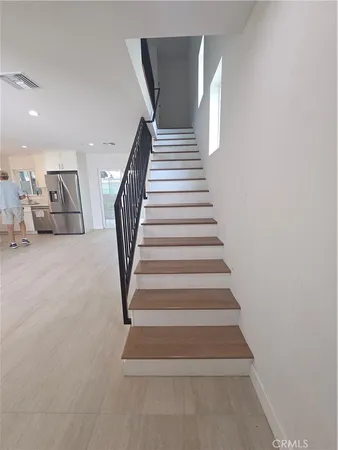 a bathroom with a sink mirror vanity and toilet