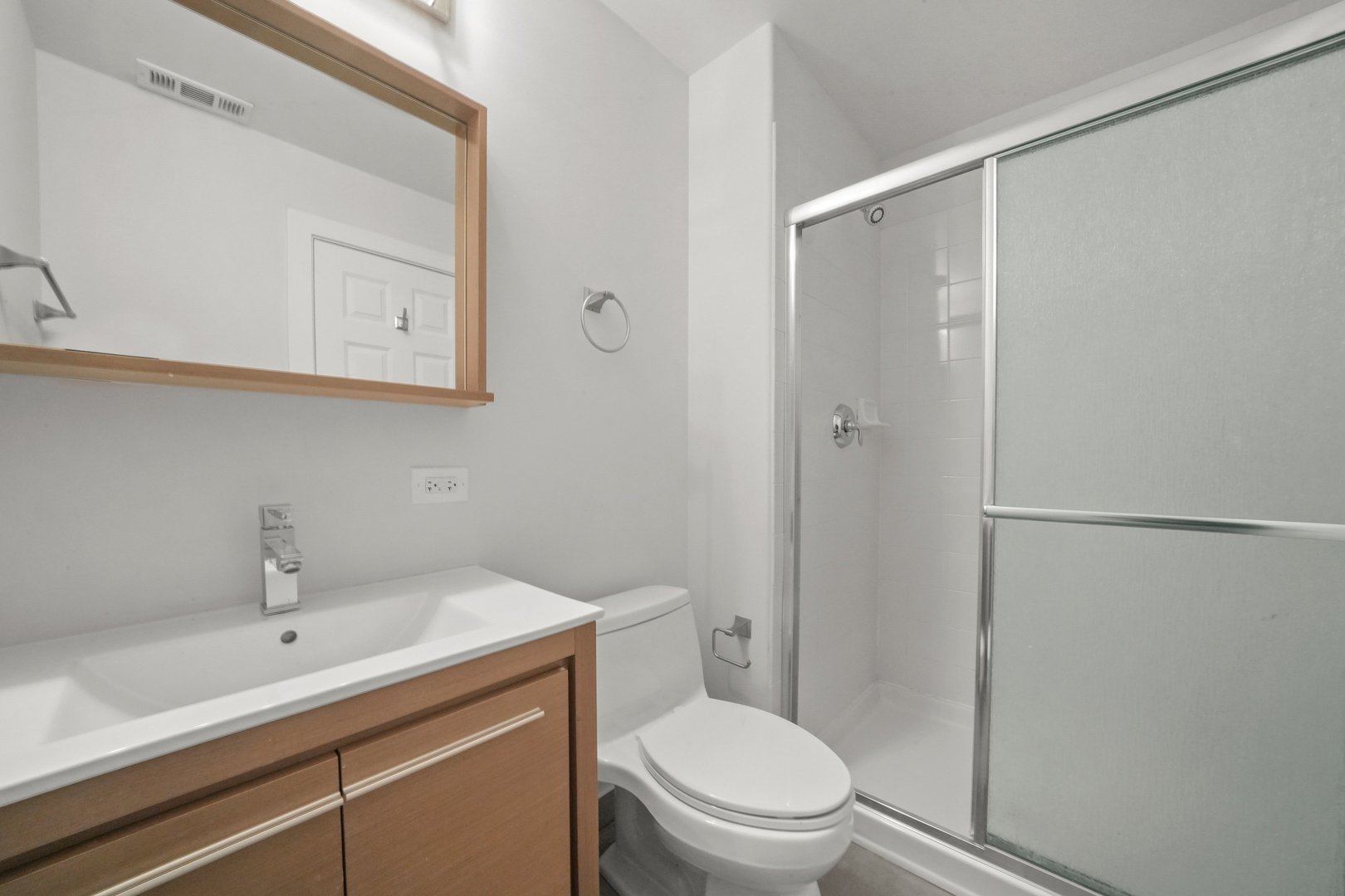 1026 West Monroe Street Chicago, IL 60607 - Photo 23 of 30 a bathroom with a sink a toilet and shower