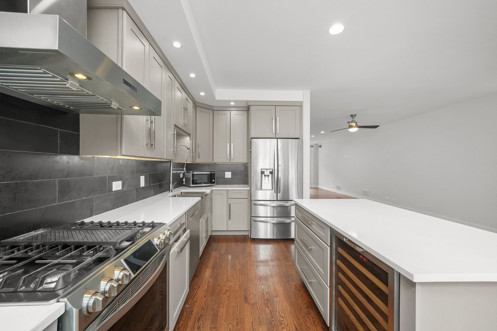 1026 West Monroe Street Chicago, IL 60607 - Photo 10 of 30 a kitchen with a sink stove and cabinets