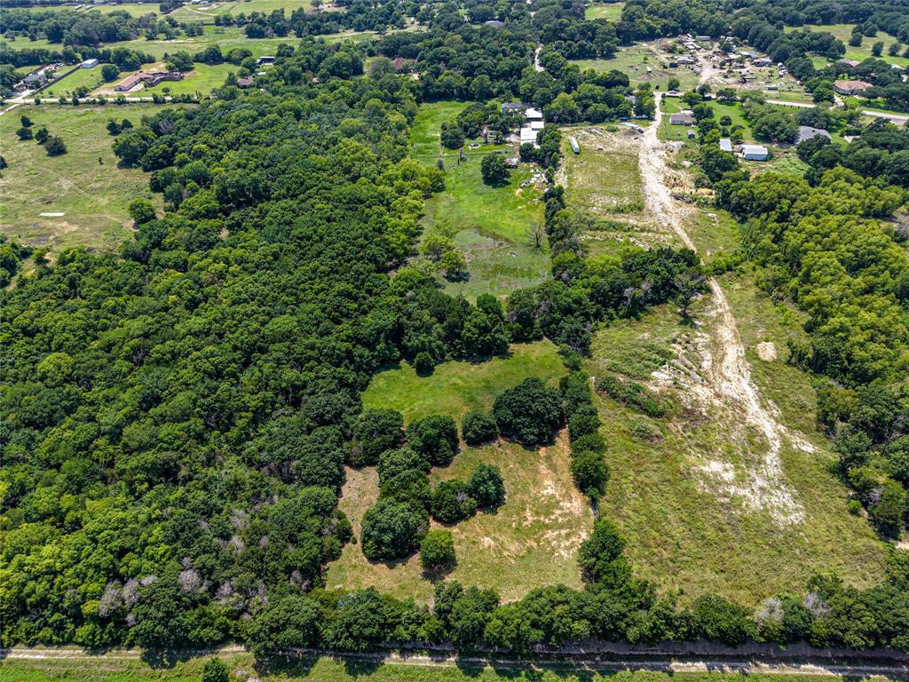 1900 Haymarket Road Dallas, TX 75253 - Photo 9 of 20 Expansive land parcel featuring dense tree coverage, open grassy areas, and cleared sections