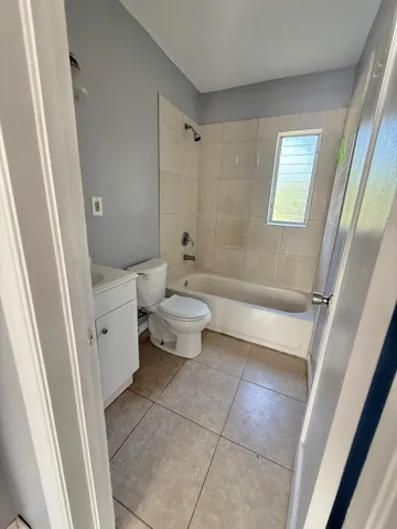 a bathroom with a toilet a sink and a bathtub