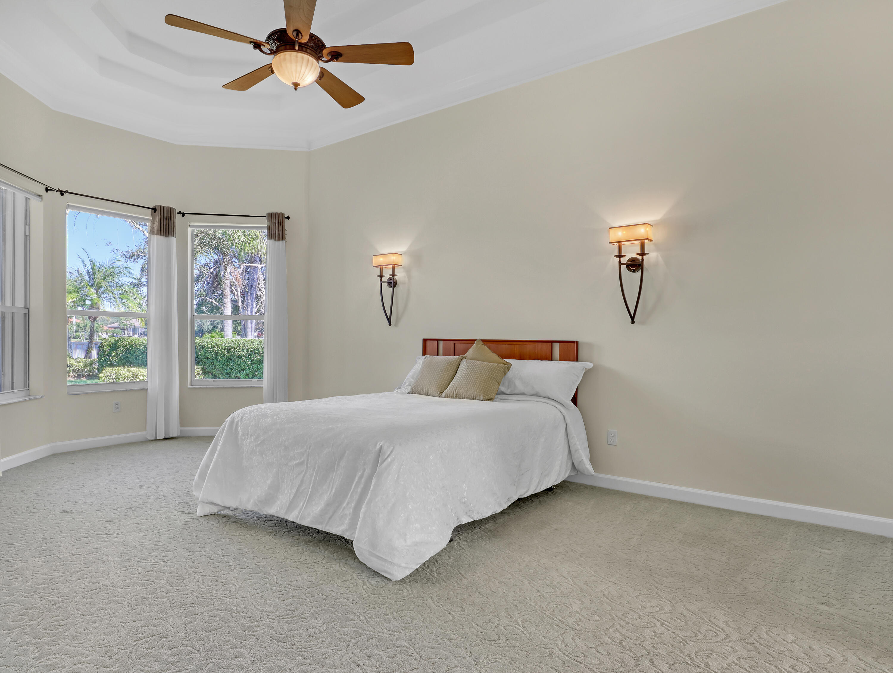 819 Southwest Bromelia Terrace Stuart, FL 34997 - Photo 17 of 48 a bedroom with a bed and window