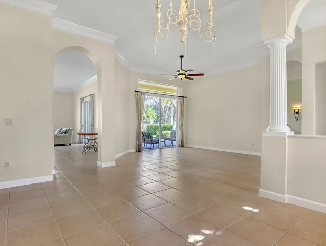a view of a bedroom with furniture and a window