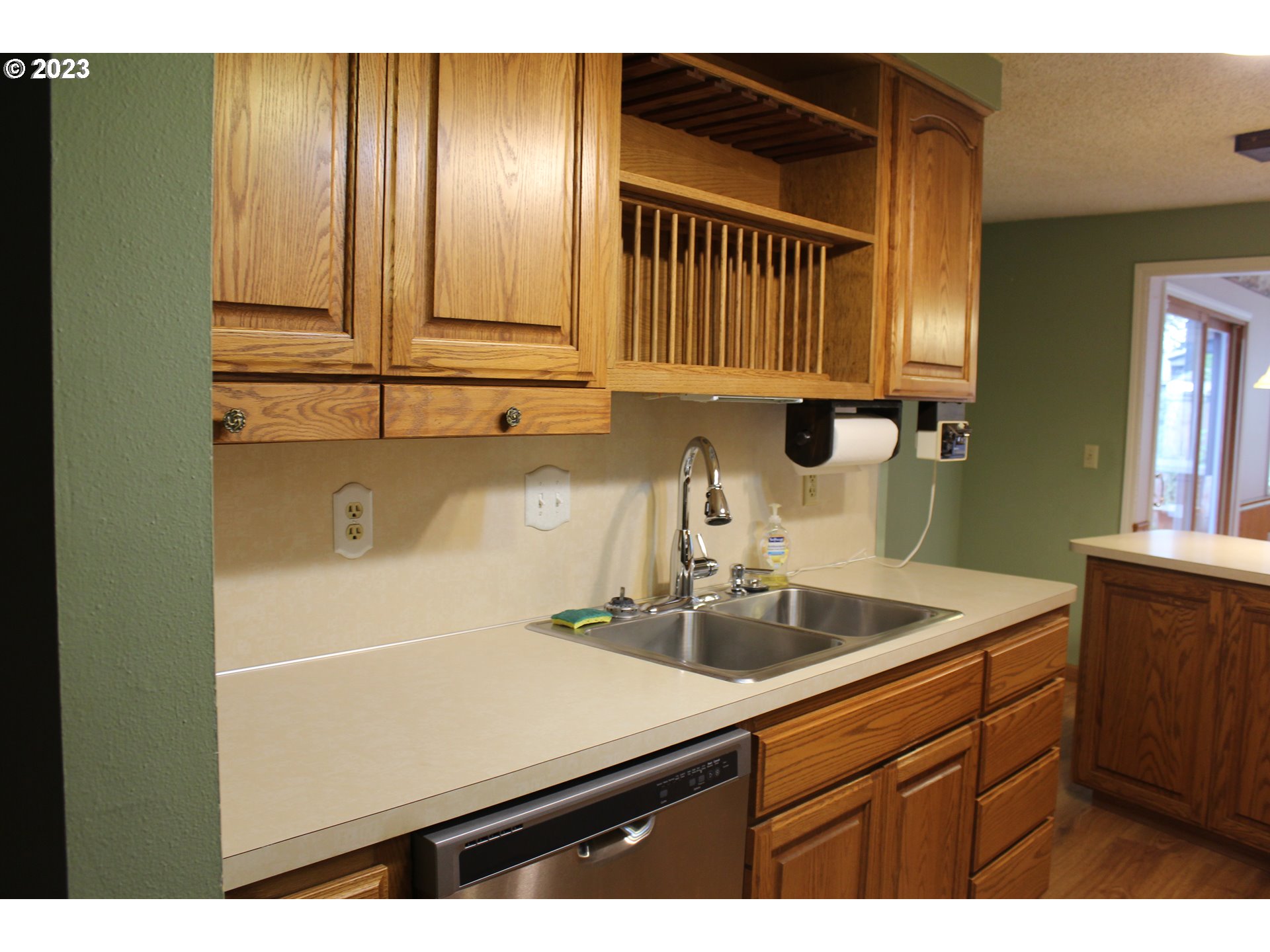 2355 11th Street Springfield, OR 97477 - Photo 6 of 16 a kitchen with a sink and cabinets
