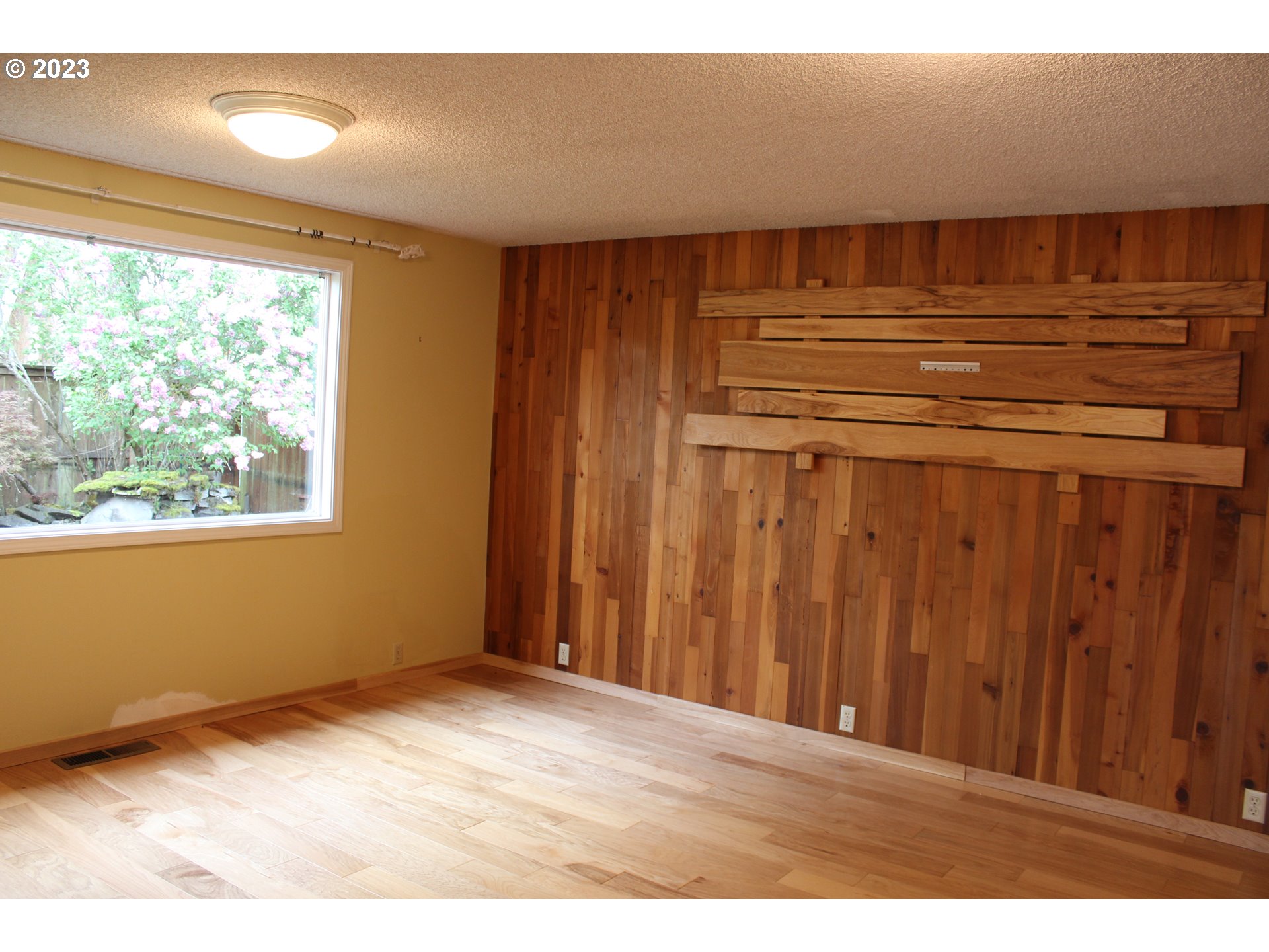 2355 11th Street Springfield, OR 97477 - Photo 9 of 16 a view of a room with wooden floor and a window
