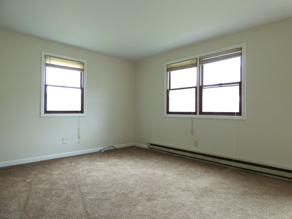 26-28 Daniel Street Springfield, MA 01151 - Photo 10 of 15 an empty room with a window