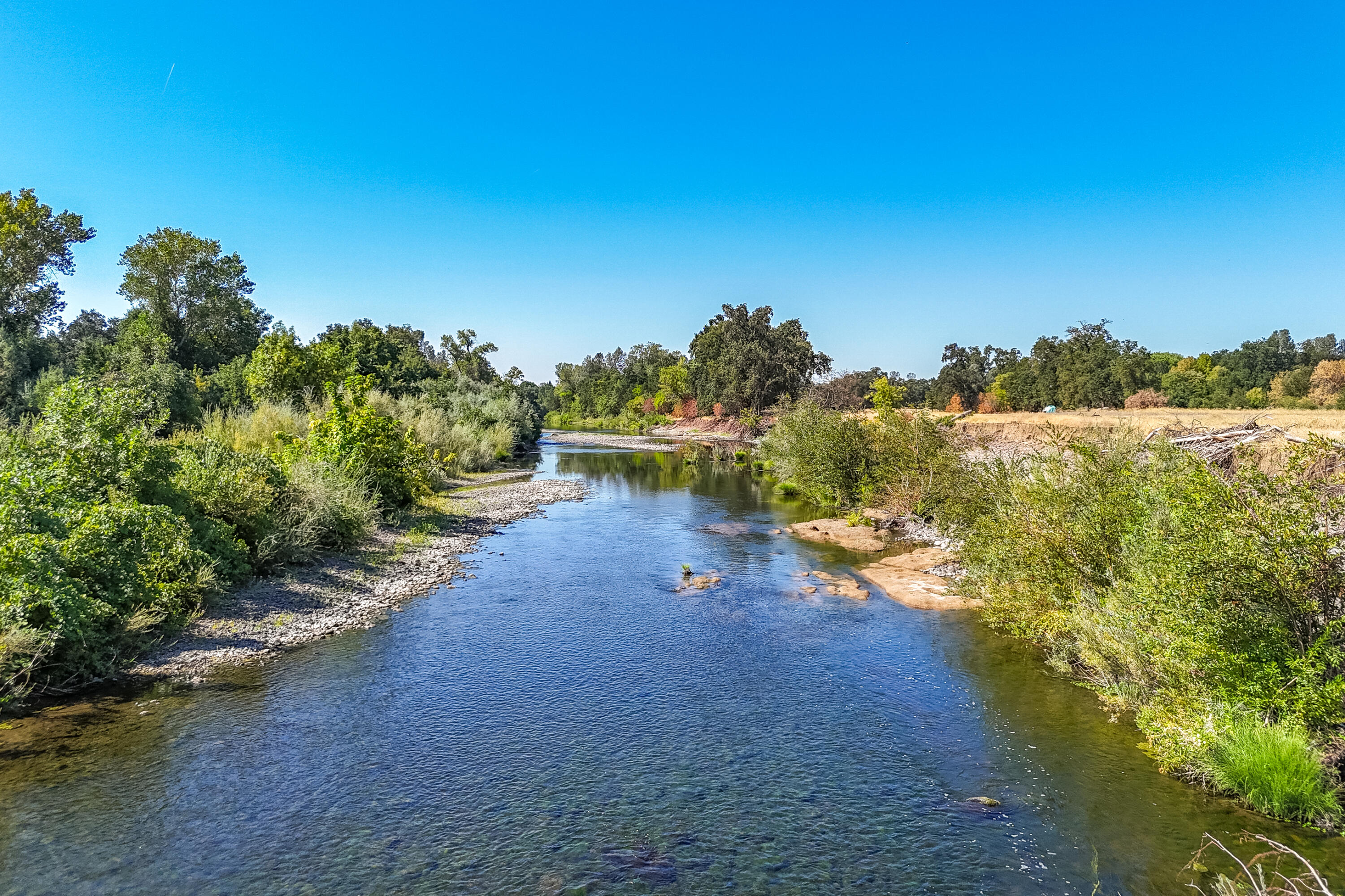 9422 Silver Bridge Road Palo Cedro, CA 96073 - Photo 6 of 27 a view of a lake with houses