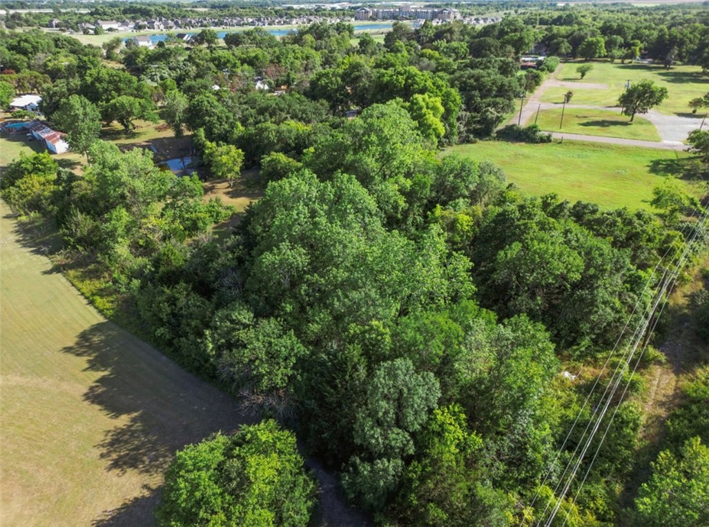 4002 South 3rd Street Waco, TX 76706 - Photo 2 of 5 an aerial view of residential houses with outdoor space and trees