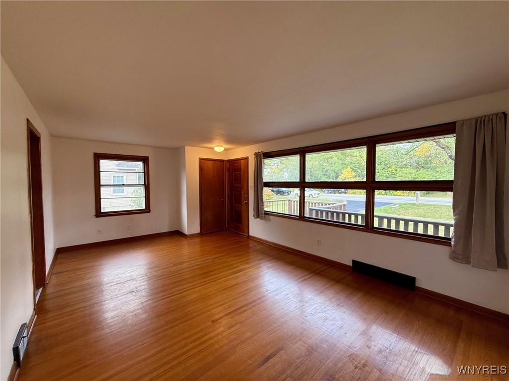 4628 Creek Rd Extension Lewiston, NY 14092 - Photo 11 of 39 The spacious living room features a convenient coa