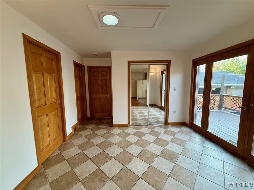 4628 Creek Rd Extension Lewiston, NY 14092 - Photo 18 of 39 The bonus room features a door that opens directly