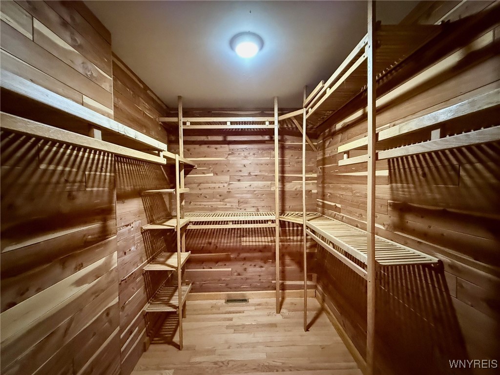 4628 Creek Rd Extension Lewiston, NY 14092 - Photo 24 of 39 Large cedar closet in the primary suite with custo