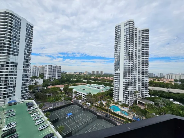 a lake with tall building in the background