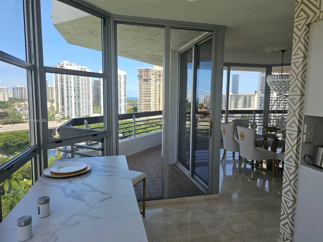 a view of a dining room with furniture and window